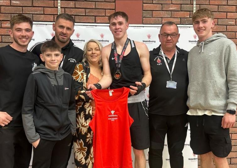Alex and family with coach Graham Brockway Alex and family with coach Graham Brockway